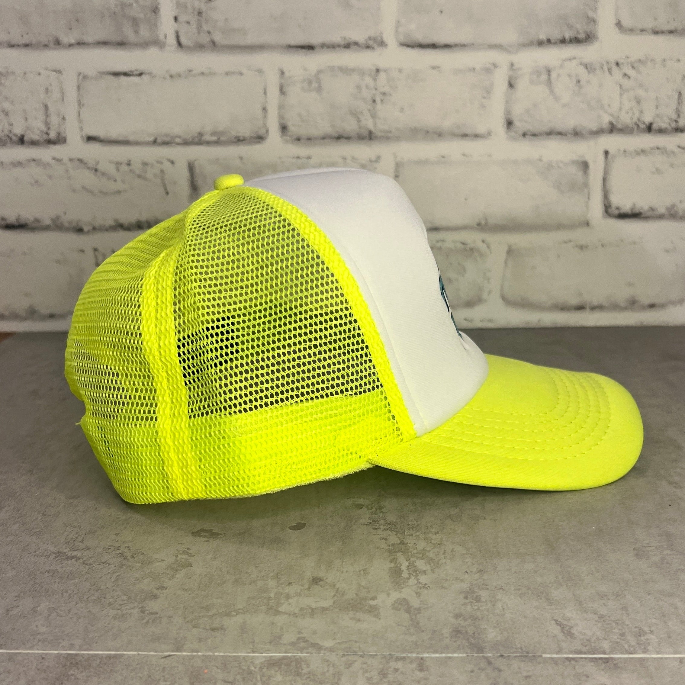 Neon yellow cap with white front panel and 'Let's Trade Pins' text